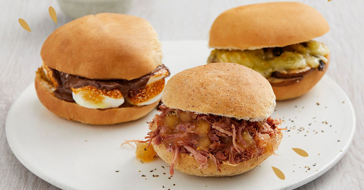A plate of three Bonfire Night savoury and sweet burgers on a white table